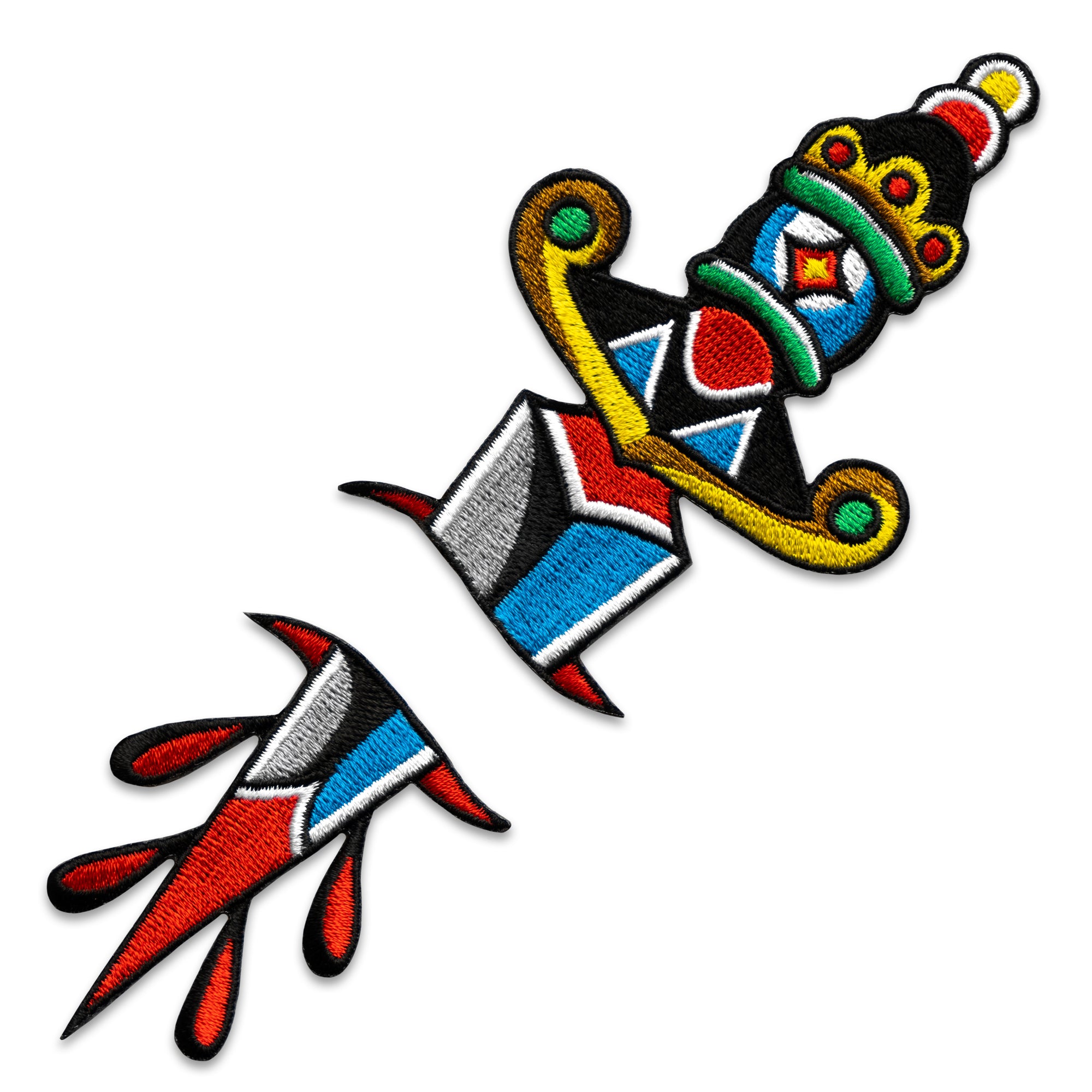 "Dagger" two-part embroidered iron-on patch designed by Brandon Ing. Patch is of traditional tattoo flash drawing of a dagger, split into two halves.  One half is the blade, and the other half is the handle.  Patch is multi colored, photographed against a white background.