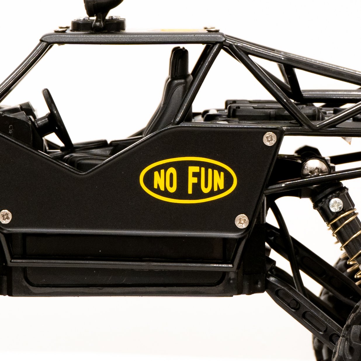 Close up of driver seat of the sick ass No Fun® RC car. Detail of the yellow No Fun® logo on door panel of car.