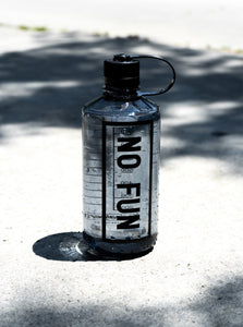 The Nalgene® + No Fun® 32oz narrow mouth bottle. Bottle is grey, with a black lid. There is a large "No Fun®" logo in black on the front. 