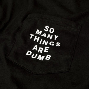 Detail of the original NO FUN® "So many things are dumb" pocket tee.  This closeup image showcases the front pocket detail, and the white text that reads "So Many Things Are Dumb".