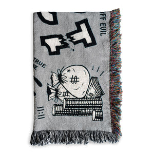 The "Alleged Jinx Removing" Woven Blanket folded against a white background.  This images shows detail of the bag of money graphic, along with "11:11", the word "EVIL", and part of the broken number "13" which are all designs found on the blanket.