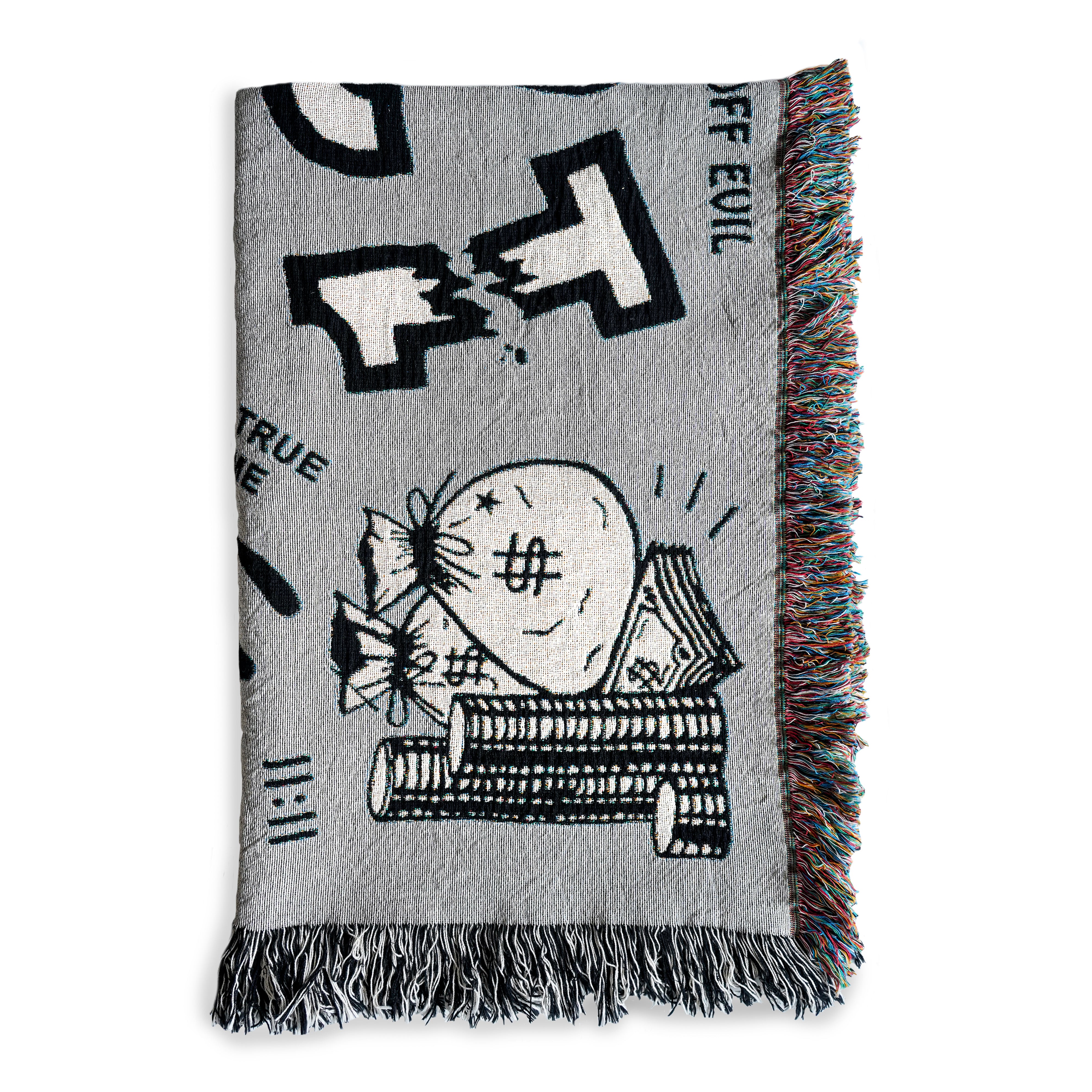 The "Alleged Jinx Removing" Woven Blanket folded against a white background.  This images shows detail of the bag of money graphic, along with "11:11", the word "EVIL", and part of the broken number "13" which are all designs found on the blanket.