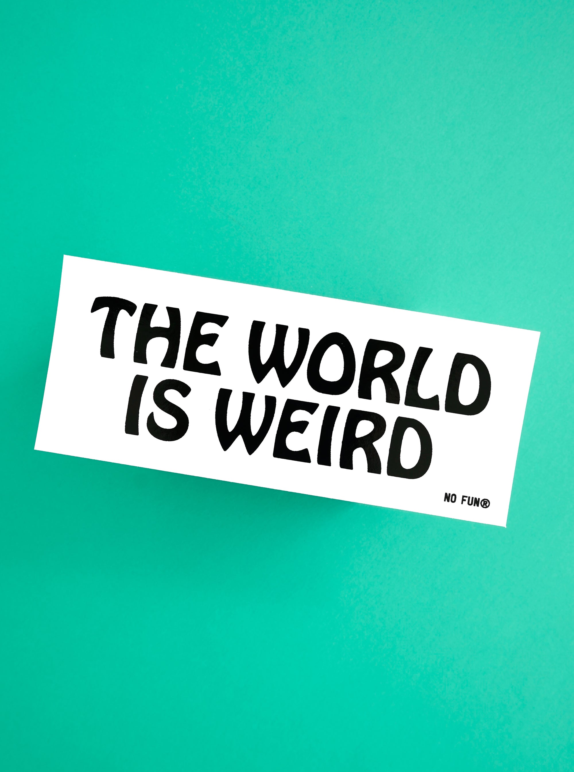 "The World is Weird" Bumper Sticker